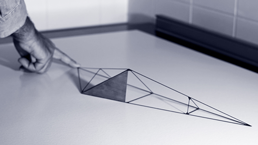 Looping video of a tetrahedral model flipping onto one stable side.